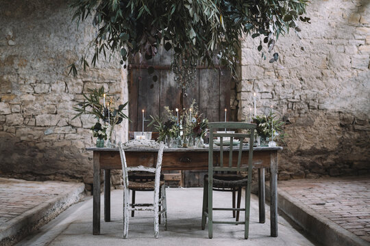 Table decorated for wedding inside an old barn
