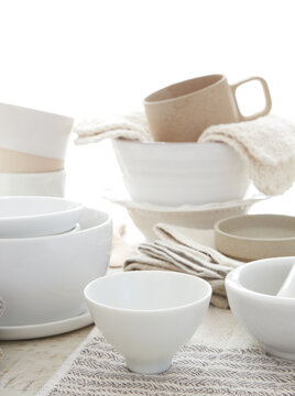 Various dishes on white wood surface