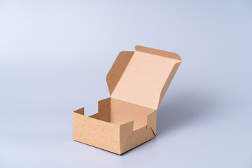 Brown paper box for food package. carton on a gray background.