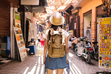 Woman with backpack exploring local market