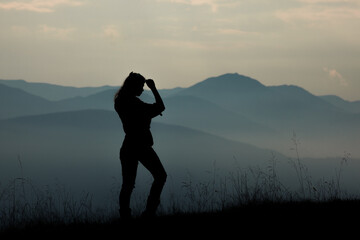 girl tourist high in the mountains