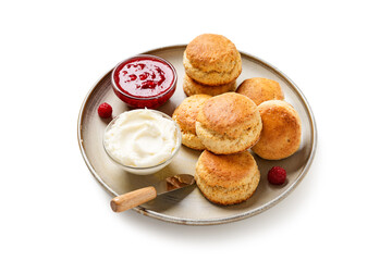 Scones with raspberry jam and clotted cream. isolated on a white background	
