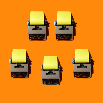 Typewriters on Orange Backdrop