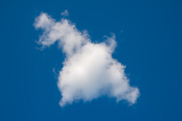 Cloud in the sky. One fluffy cloud. Natural landscape background.