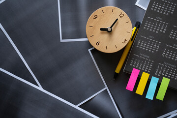 Obraz premium close up of calendar and alarm clock on photocopy paper background