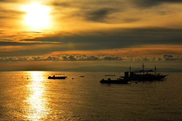 Sunrise scenery at the sea in Dauin, Negros Oriental, Philippines