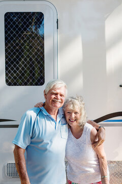 baby boomer in front of caravan