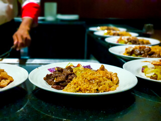 Beef stir fry with egg fried rice plates dished up