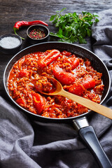 ragout with whole plum tomatoes and pork sausages