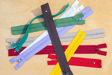 zippers for clothing of various colors © seregg