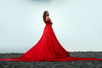 woman in a long red dress. Back view