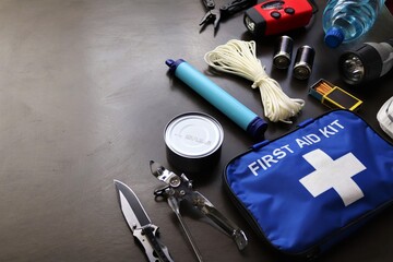 A survival kit is useful to have in the event of an emergency such as floods,fires,earthquakes,hurricanes and other natural disasters.These items can be placed in a bag prepared and ready to go  - obrazy, fototapety, plakaty