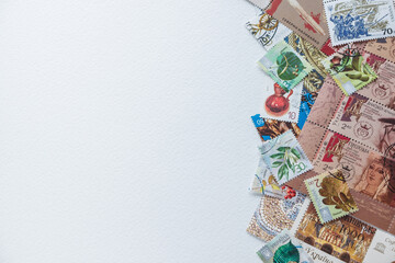 Composition of stamps scattered on a white background. Ukrainian stamps. Copy space.