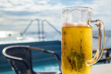 Cold Beer on a beach in big moist glass