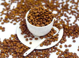 white coffee Cup and coffee beans on a white background, the concept of cheerfulness