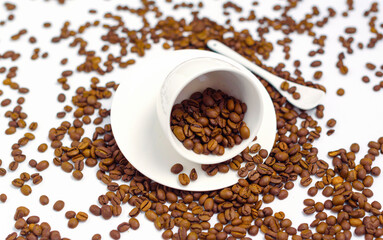 white coffee Cup and coffee beans on a white background, the concept of cheerfulness