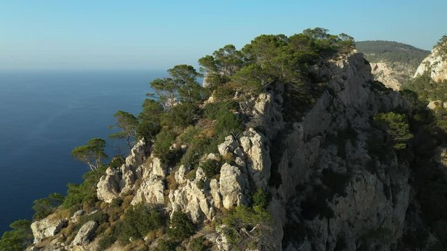 Rocky summit on cliffs facing the Mediterranean Sea. Ibiza island.