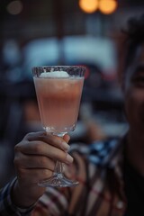 person holding a cocktail