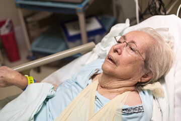 Senior 80 plus year old woman in a hospital bed