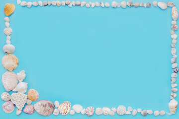 blue background in a frame of light shells and small white stones