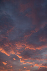 Fototapeta na wymiar The sunset sky is blue-purple with bright clouds