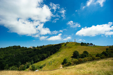 bottom view of the top of mount mottarone in italy with ski slopes in summer