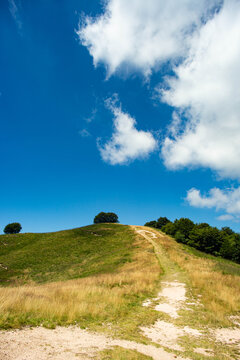 bottom view of the top of mount mottarone in italy with ski slopes in summer