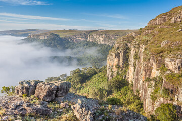 Fototapeta na wymiar Dawn with fog at Guartela Canyon - sixth largest canyon in the world in length - Tibagi/ Parana - Brazil