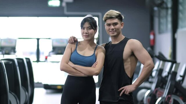 Portrait young asian man and woman attractive fitness couple healthy.