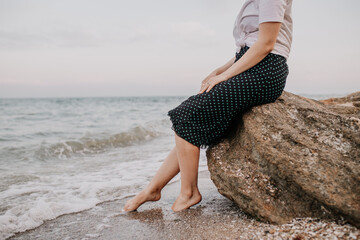 young woman in white dress on beach