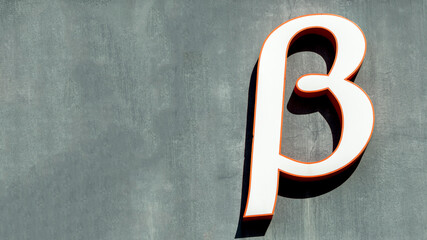 large letter beta on a grey background