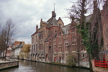 Fototapeta premium Historic buildings viewed from the Dijver Canal in the medieval city of Bruges, Belgium