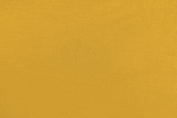 Mango homogeneous background with a textured surface, fabric.