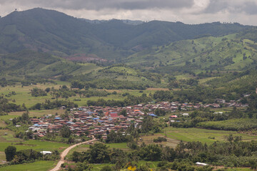 Fototapeta na wymiar Village state on hill lower view from sky