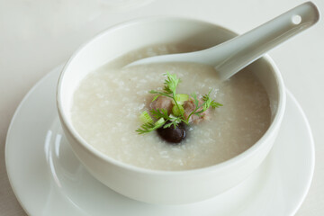 close up congee in white bowl