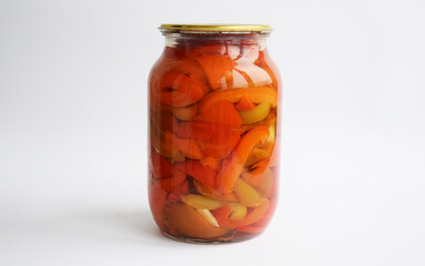 glass jar of canned vegetables. various vegetables, peppers, onions, carrots, tomatoes. Lecho, vegetable salad. Isolate on white background