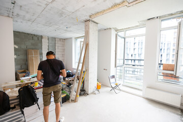 Interior of apartment with materials during on the renovation and construction, remodel wall from...