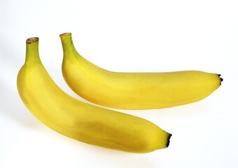 BANANAS AGAINST WHITE BACKGROUND