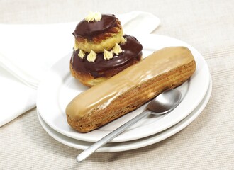 FRENCH CAKES CALLED CHOCOLATE RELIGIEUSE AND COFFE ECLAIR