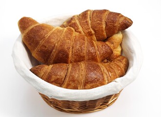 CROISSANTS IN BASKET AGAINST WHITE BACKGROUND