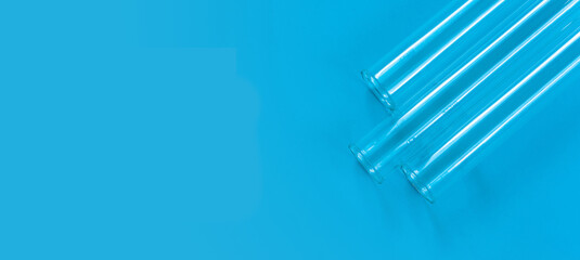 Chemical test tubes on a blue background with a blank space for your text.