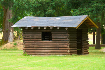 A log building in a park 