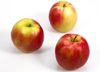PINK LADY APPLE malus domestica AGAINST WHITE BACKGROUND