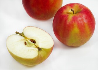 PINK LADY APPLE malus domestica AGAINST WHITE BACKGROUND