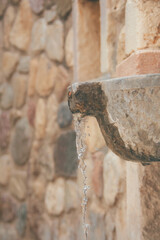 old stone water source in Greece