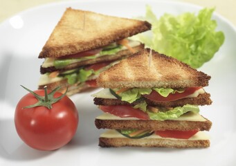 FAST FOOD, CLUB SANDWICH WITH SALAD AND TOMATO