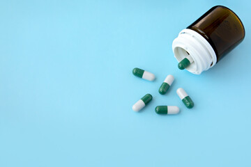 bottle of medicine pills on a blue background