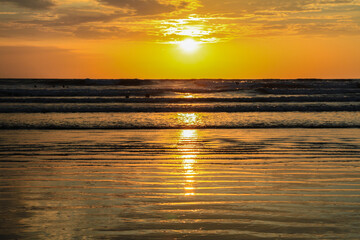 Sunset at beautiful beach at Canoa, pacific coast, Puerto Lopez, Manatí, Ecuador