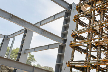 Construction site using metal girders and rebar
Heavy iron beams and reinforced rods used to construct building structures

