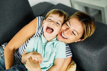 child son mother family happy playing kid childhood mom love fun smiling little woman home
